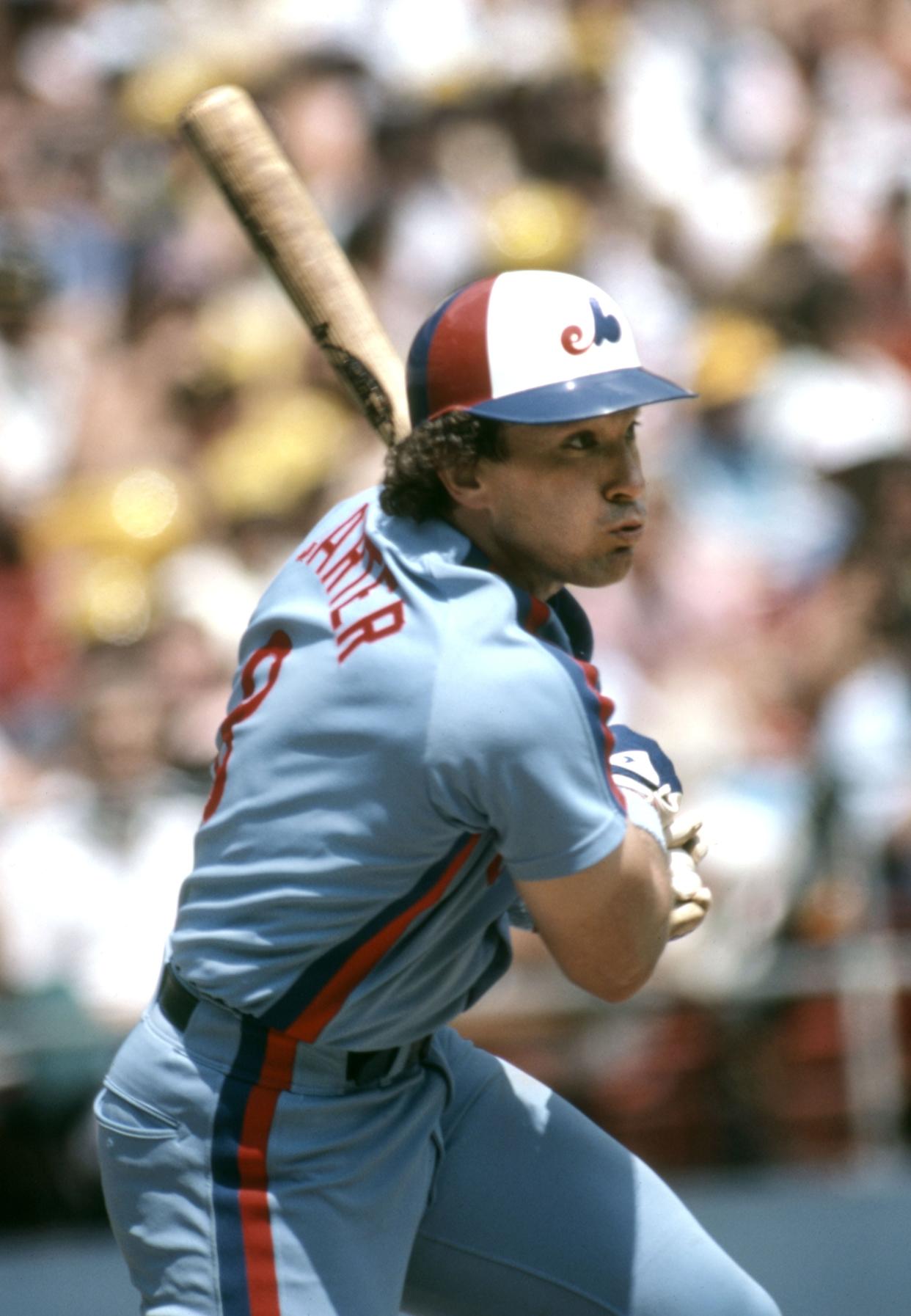 Aug 1983; Pittsburgh, PA, USA; FILE PHOTO; Montreal Expos catcher Gary Carter hits the ball against the Pittsburgh Pirates at Three Rivers Stadium. Mandatory Credit: Malcolm Emmons-USA TODAY Sports