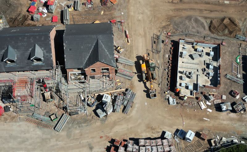 Partly finished houses are seen on a new housing development under construction in Liverpool, Britain