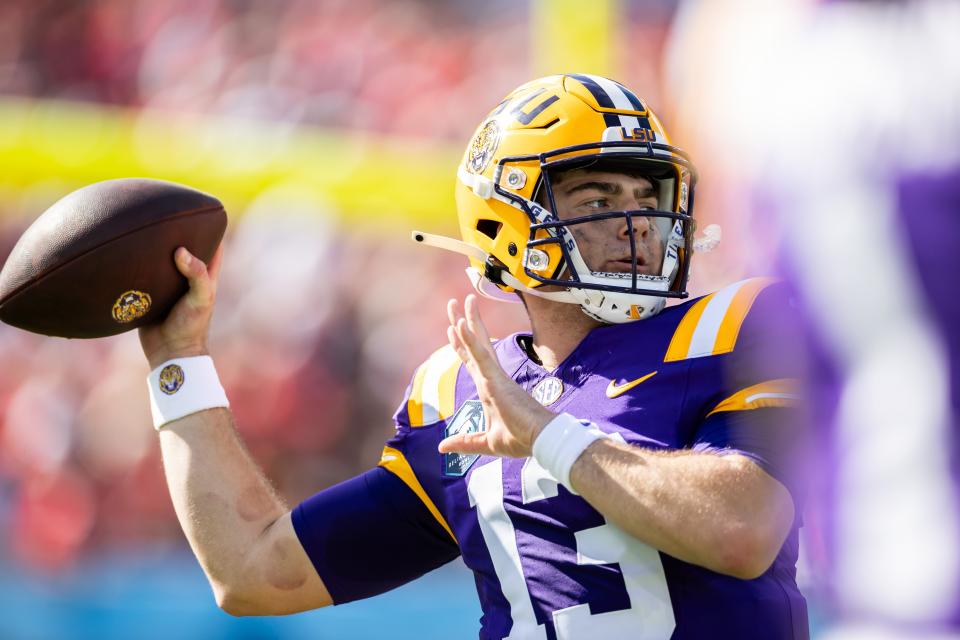 Jan 1, 2024; Tampa, FL, USA; LSU Tigers quarterback Garrett Nussmeier (13) looks to throw during the first half against the Wisconsin Badgers at Raymond James Stadium. Mandatory Credit: Matt Pendleton-USA TODAY Sports