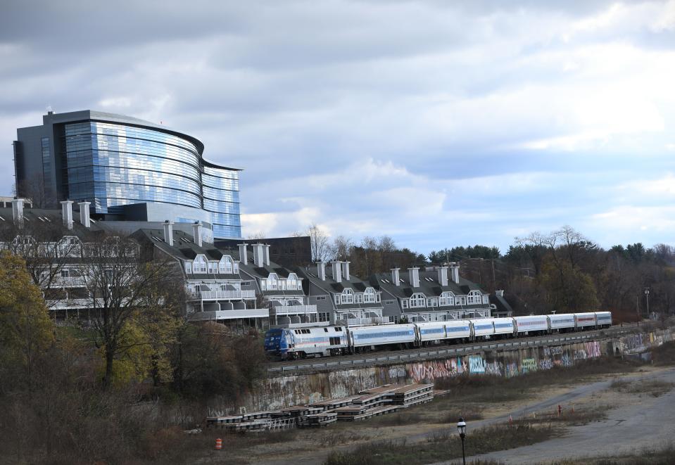 A Metro North train passes between the De Laval site, Vassar Brothers Medical Center and Hudson Pointe in the City of Poughkeepsie on November 28, 2022.