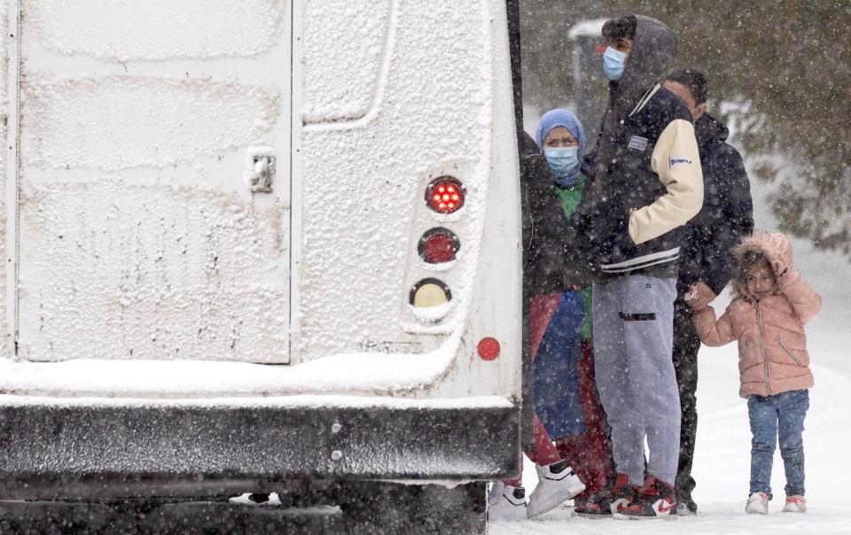 Officials in Quebec have started putting migrants on buses to other parts of the country - REUTERS