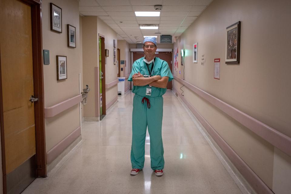 Arizona Burn Center Director Dr. Kevin Foster stands in a hallway in Valleywise Health medical center in Phoenix on July 25, 2022.