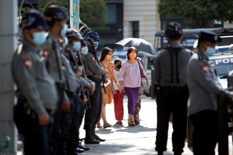 Police stan guard as they wait for protests against coup in Yangon