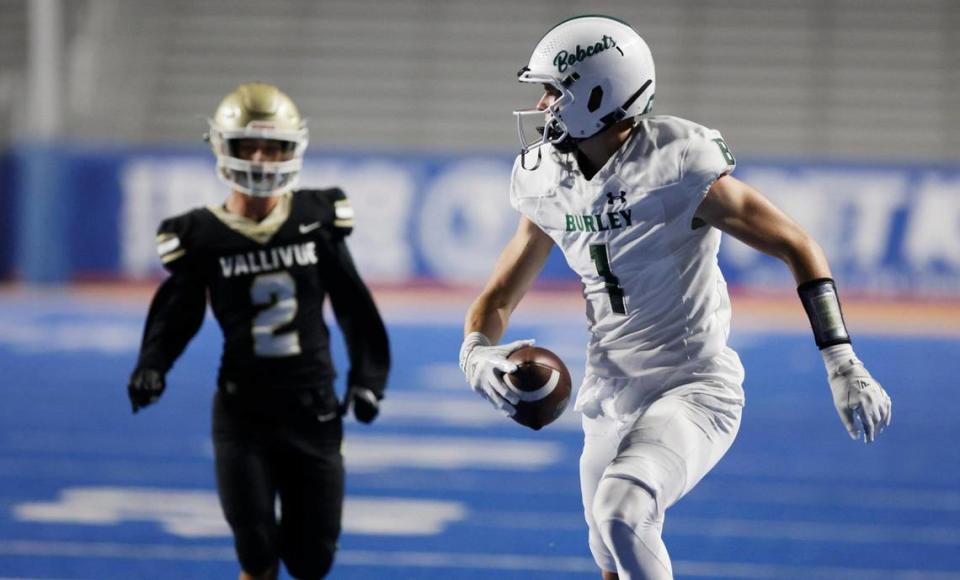 Burley wide receiver Gatlin Bair runs away from Vallivue defensive player Briggs Maier for a long first-half touchdown during the Battle in Boise at Albertsons Stadium, Friday, Sept. 1, 2023.