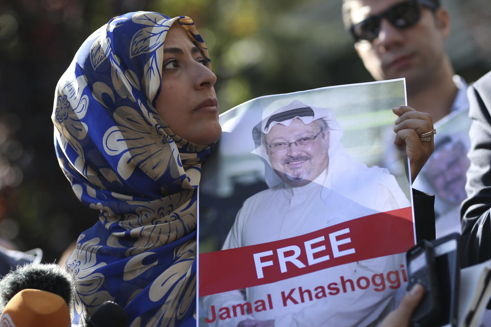 FILE - In this Friday, Oct. 5, 2018 file photo, Tawakkol Karman, the Nobel Peace Prize laureate for 2011 holds a picture of missing Saudi writer Jamal Khashoggi as she speaks to journalists near the Saudi Arabia consulate, in Istanbul, Turkey. Khashoggi was a Saudi insider. He rubbed shoulders with the Saudi royal family and supported its efforts to nudge the entrenched ultraconservative clerics to accept reforms. He was a close aide to the kingdom’s former spy chief and was a leading voice in the country’s prominent dailies. In a dramatic twist of fate, Khashoggi disappeared on Tuesday, Oct. 2, 2018, after visiting his country’s consulate in Istanbul and may have been killed there. (AP Photo/Emrah Gurel, File)