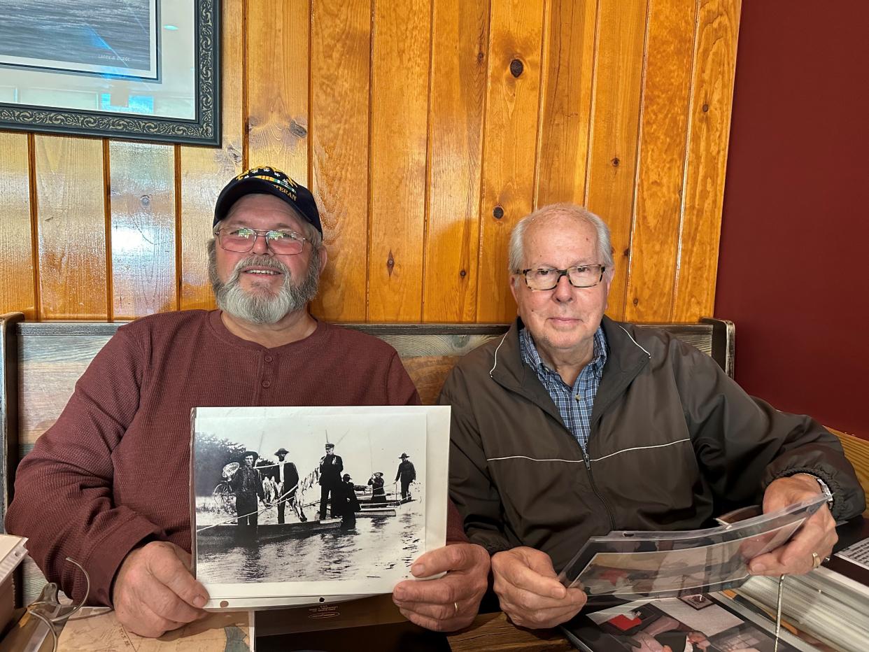 Steve Edens and Marion Andrews have been collecting information on Sloop Point's history for years and have large books full of old photos, newspaper clippings and notes.