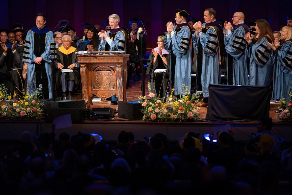 Santa Ono, left, is introduced by Paul Brown, chair of the Board of Regents, as University of Michigan's 15th president during the official inauguration ceremony at Hill Auditorium in Ann Arbor on Tuesday, March 7, 2023.