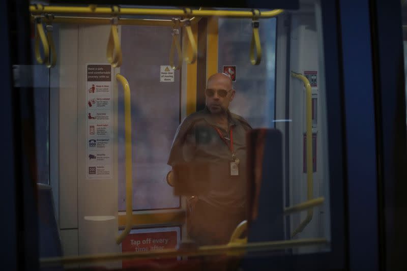 A man travels in an almost empty tram wagon during a workday following the implementation of stricter social-distancing and self-isolation rules to limit the spread of the coronavirus disease (COVID-19) in Sydney