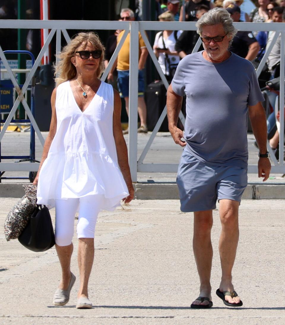 Kurt Russell sighted with Goldie Hawn for a walk at the promenade of Skiathos Island. Goldie Hawn was dressed in white. Before they have breakfast at Golden Cafe in Skiathos town.