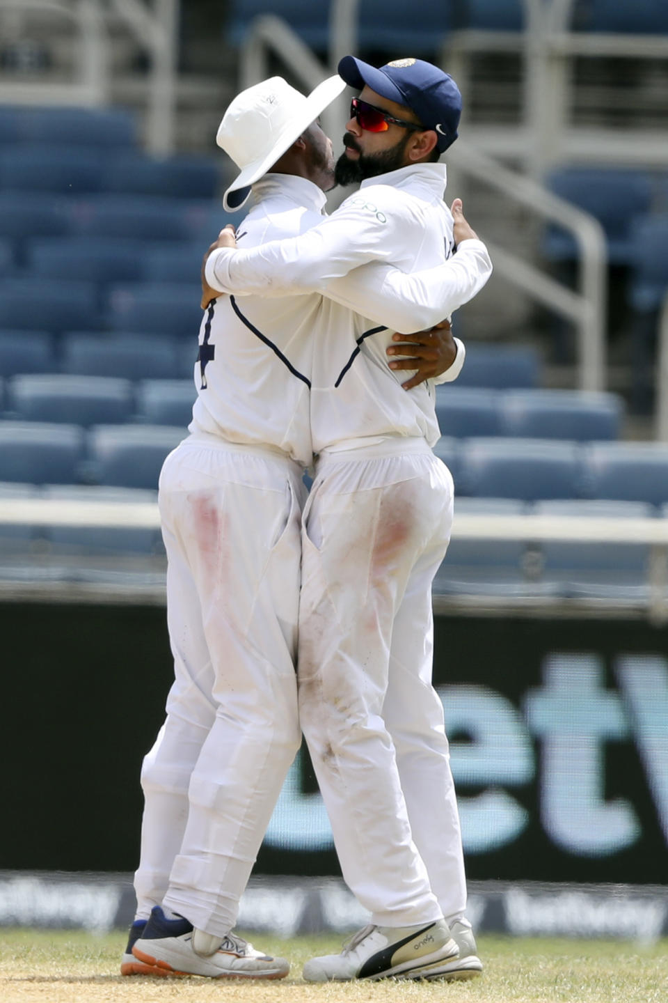 India's captain Virat Kohli and Ravindra Jadeja embrace at the end of day four of the second Test cricket match against West Indies at Sabina Park cricket ground in Kingston, Jamaica Monday, Sept. 2, 2019. India won by 257 runs. (AP Photo/Ricardo Mazalan)