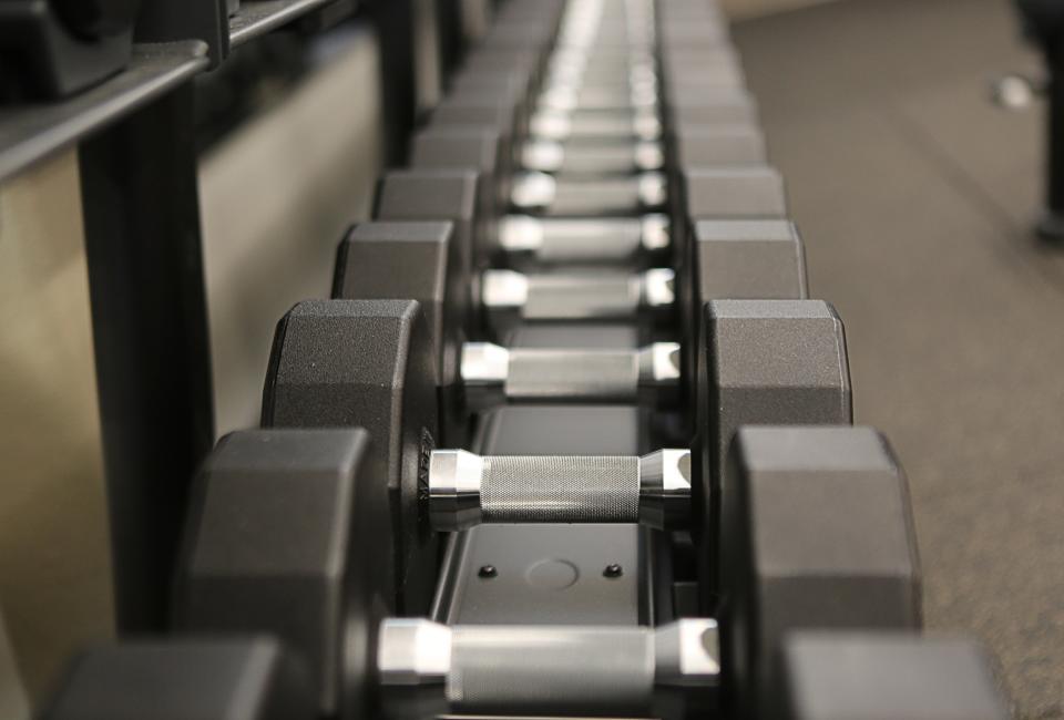 A rack of dumbbells line the wall of the new Middletown YMCA.