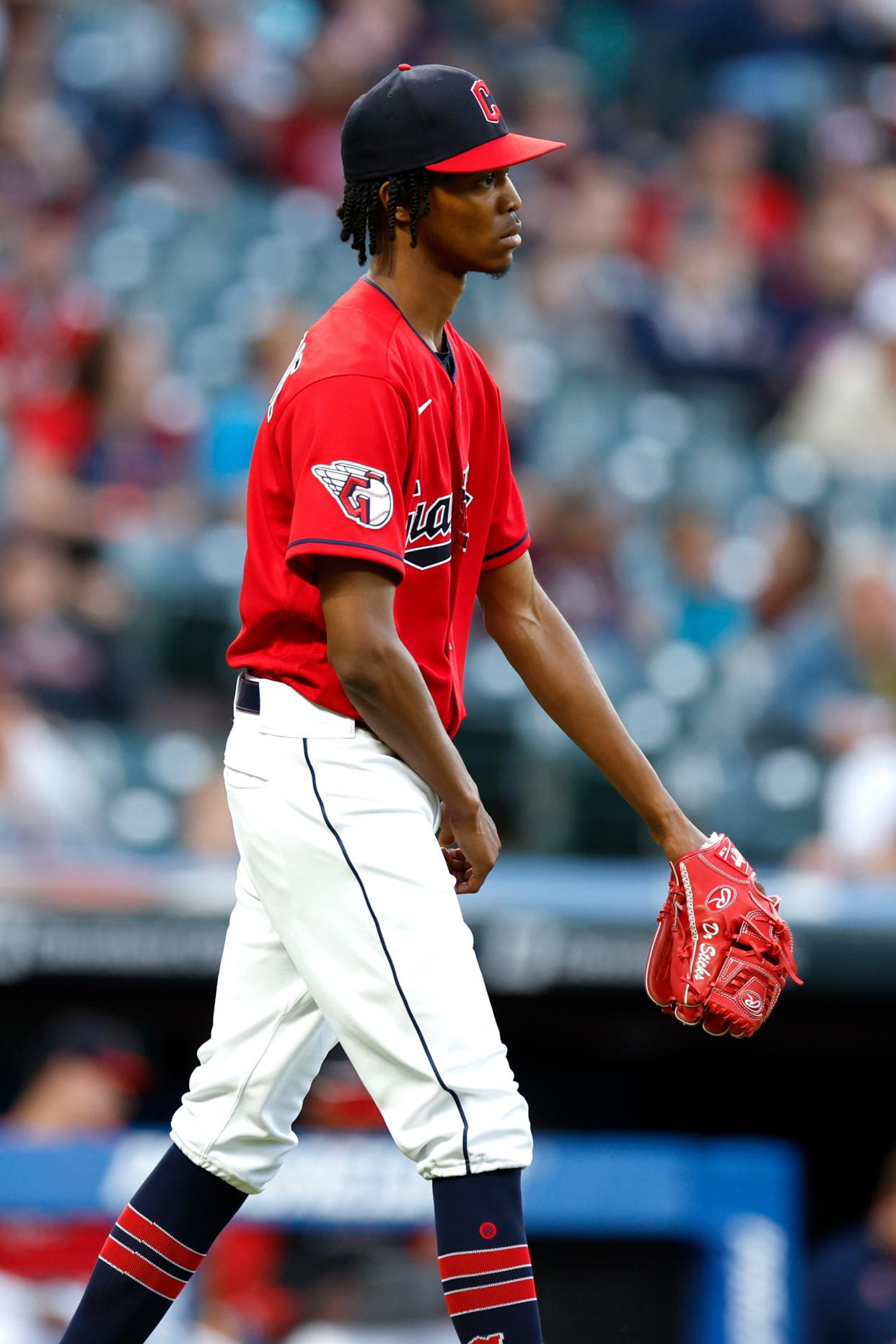 Cleveland Guardians starting pitcher Triston McKenzie walks back to the mound after giving up a two-run home run to Minnesota Twins' Nick Gordon during the sixth inning of a baseball game Monday, June 27, 2022, in Cleveland. (AP Photo/Ron Schwane)