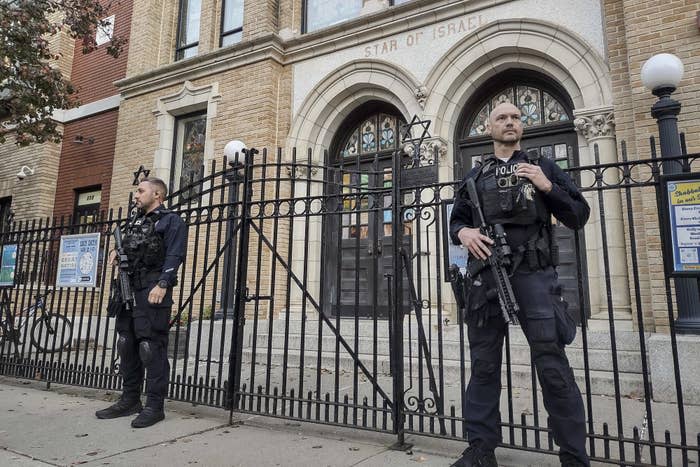 Police officers guard a synagogue in Hoboken, New Jersey, on Nov. 3 following the FBI alert.