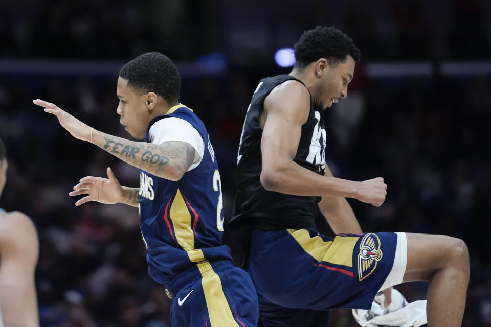 New Orleans Pelicans guard Jordan Hawkins, left, celebrates his 3-point shot with guard Trey Murphy III in the second half of an NBA basketball game in New Orleans, Wednesday, Jan. 17, 2024. The Pelicans won 132-112 and set a franchise record of 24 3-pointers in a game. (AP Photo/Gerald Herbert)