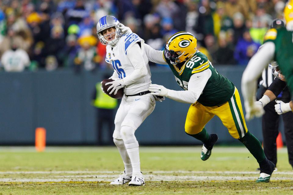 Detroit Lions quarterback Jared Goff is sacked by Green Bay Packers defensive lineman Devonte Wyatt.
