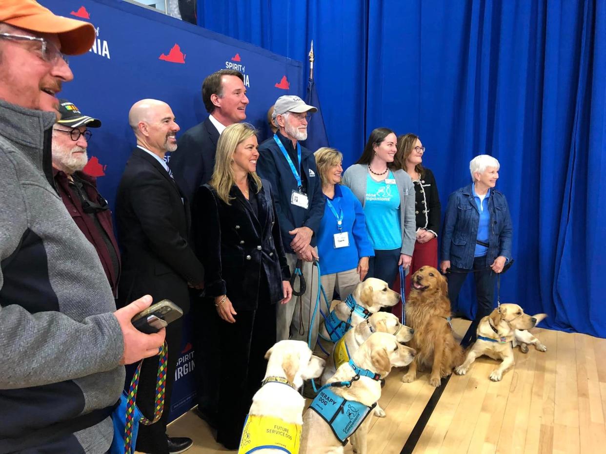 Governor Glenn Youngkin and First Lady Suzanne S. Youngkin donate salary to Canine Companions at the Petersburg Family YMCA on Friday, December 1.