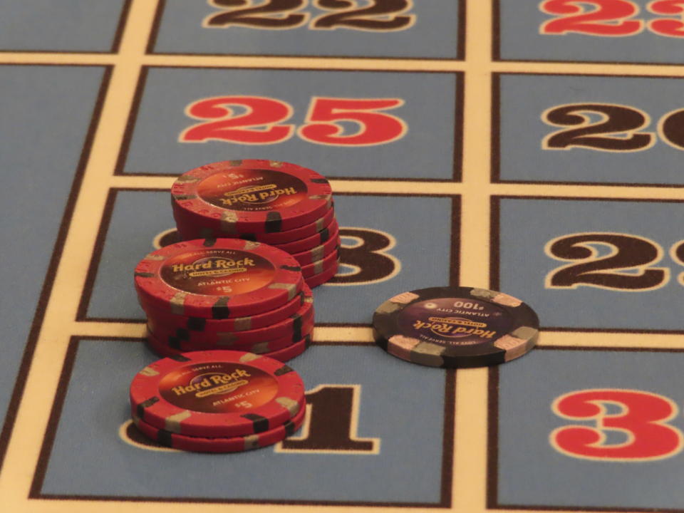 Gambling chips sit on a roulette table during a game at the Hard Rock casino in Atlantic City N.J., on May 17, 2023. New Jersey gambling regulators on Monday, June 19, 2023, released figures showing that Atlantic City's casinos, horse tracks and their online partners won nearly $471 million in May, an increase of 9.4% from a year earlier. But the amount of money the casinos won from in-person gamblers declined by 2.4% to $227.3 million. (AP Photo/Wayne Parry)