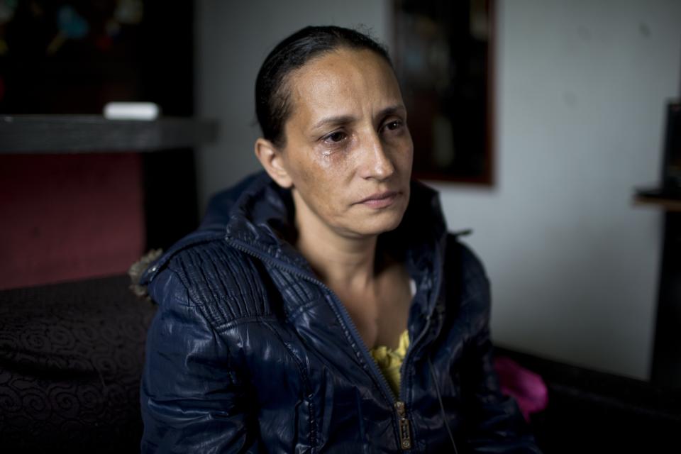 Judith Perez, mother of Karen Palacios, cries during an interview at her house in Los Teques in the outskirts of Caracas, Venezuela, Tuesday, July 16, 2019. Karen Palacios who plays the clarinet and was cut from the National Philharmonic for criticizing the government, and who was detained for 6 weeks, was released today. (AP Photo/Ariana Cubillos)