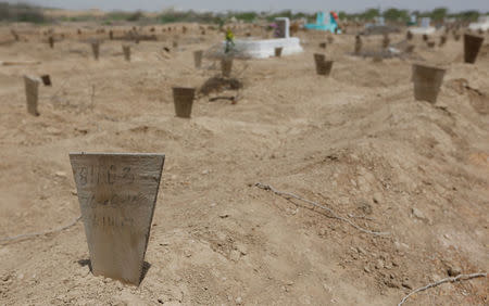 Grave markers of victims of last year's heatwave are seen at a graveyard in Karachi, Pakistan May 13, 2016. REUTERS/Akhtar Soomro