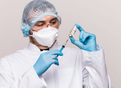   <span class="attribution"><a class="link " href="https://www.shutterstock.com/image-photo/study-covid19-infection-male-doctor-examines-1705078219" rel="nofollow noopener" target="_blank" data-ylk="slk:F8 studio/Shutterstock;elm:context_link;itc:0;sec:content-canvas">F8 studio/Shutterstock</a></span>