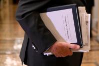 Sen. Leahy carries paperwork as he exits the Senate chamber after the third day of the Senate impeachment trial of President Trump