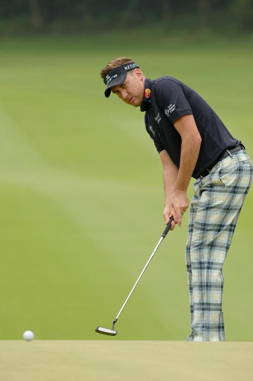 This photo taken and received by OneAsia on April 24, 2014 shows Ian Poulter of England putting during the first round of the Volvo China Open at the Genzon Golf Club in the southern Chinese city of Shenzhen