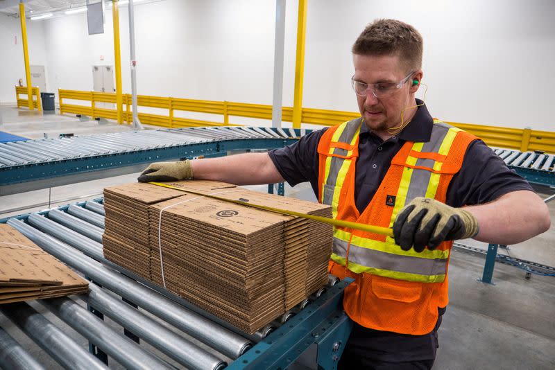 FILE PHOTO: A worker at the DS Smith cardboard box manufacturing plant in Lebanon, Indiana