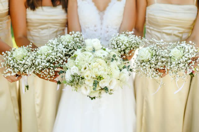 <p>Getty</p> A bride with her bridesmaids (stock image)