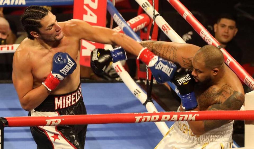 Anthony ‘El Gigante’ Mireles of Iowa lands a left punch against Brandon Hughes of Alabama in a heavyweight bout at the Save Mart Center on March 4, 2022.