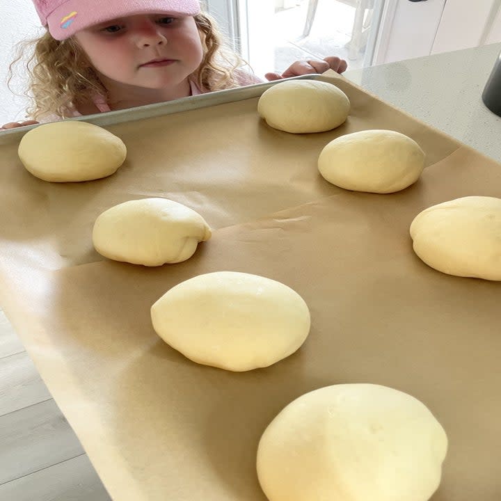 Hamburger bun dough on a sheet pan