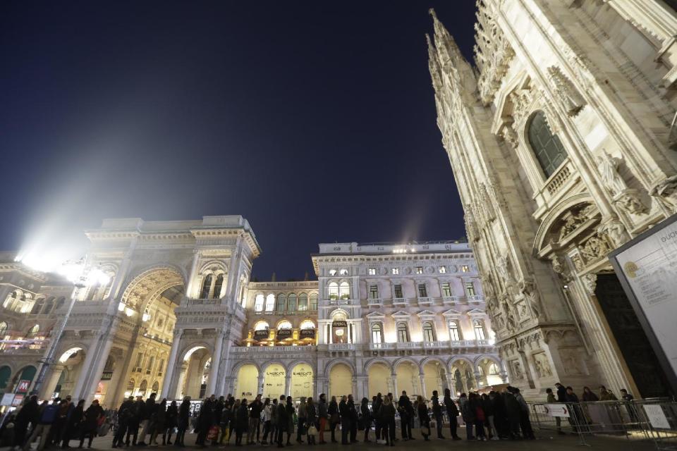 Tourists line up for security checks performed by Italian soldiers to enter the Duomo gothic cathedral in Milan, Italy, Wednesday, Dec. 23, 2016. The Tunisian man suspected of driving a truck into a crowded Christmas market in Berlin was killed early Friday in a shootout with police in Milan, ending a Europe-wide manhunt, Italy’s interior minister said. (AP Photo/Luca Bruno)