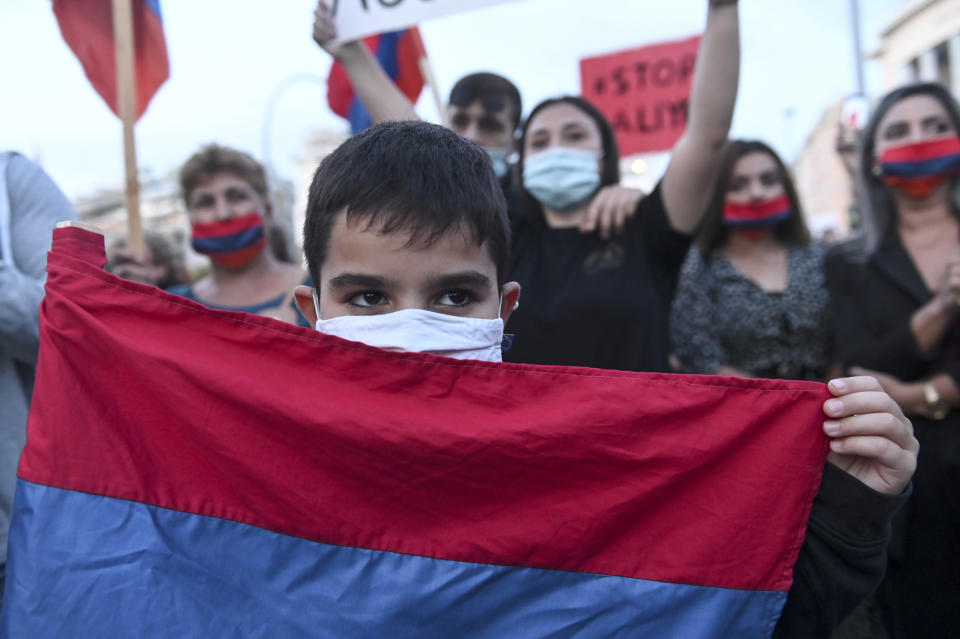 Pro-Armenian protesters take part in a demonstration in support of Armenia, in the northern city of Thessaloniki, Greece, Saturday, Oct. 3, 2020. Heavy fighting between Armenia and Azerbaijan continued Saturday in their conflict over the separatist territory of Nagorno-Karabakh, while Azerbaijan's president criticized the international mediators who have tried for decades to resolve the dispute. (AP Photo/Giannis Papanikos)