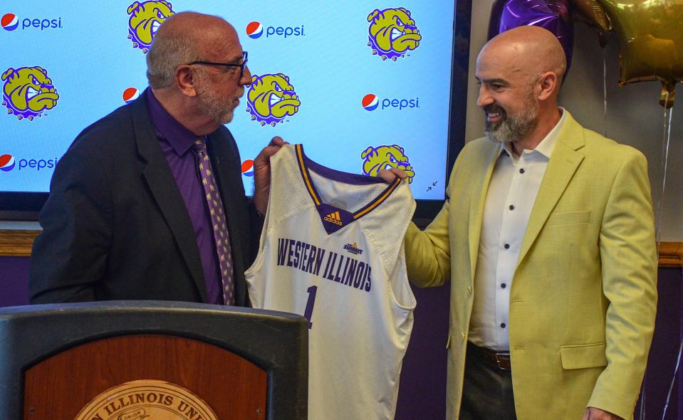 Chad Boudreau, right, was introduced as the Western Illinois men's basketball coach on April 13, 2023, in Macomb. At left is WIU athletics director Paul Bubb.