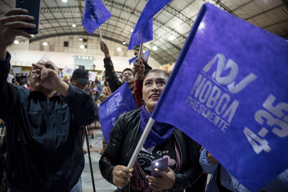 Supporters of presidential candidate Daniel Noboa celebrate the early results of the runoff presidential election, in Quito, Ecuador, Sunday, Oct. 15, 2023. (AP Photo/Carlos Noriega)
