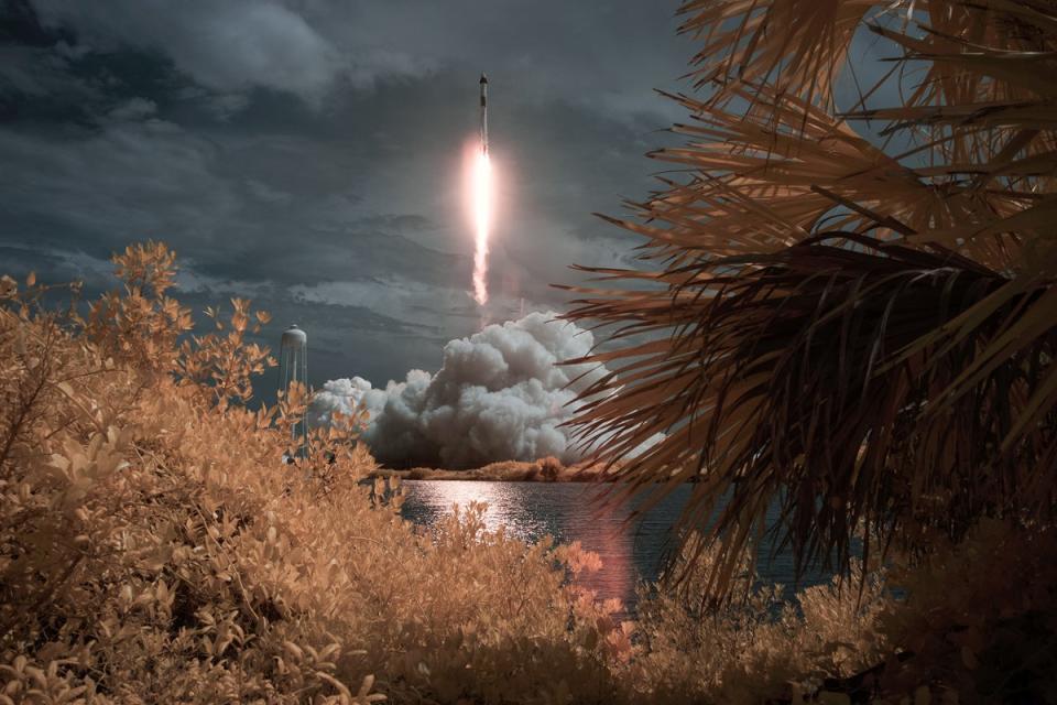 In this NASA handout image, A SpaceX Falcon 9 rocket carrying the company's Crew Dragon spacecraft is seen in this false color infrared exposure as it is launched on NASAs SpaceX Demo-2 mission to the International Space Station with NASA astronauts Robert Behnken and Douglas Hurley onboard, Saturday, May 30, 2020, at NASAs Kennedy Space Center in Florida. (Getty Images)