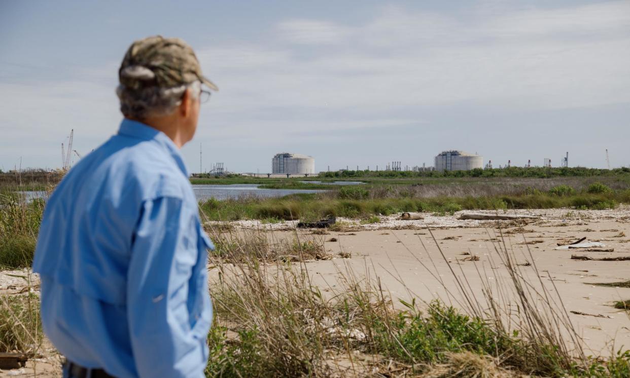 <span>John Allaire at the site of a proposed liquified natural gas plant, with another plant in the background.</span><span>Photograph: Bryan Tarnowski/The Guardian</span>