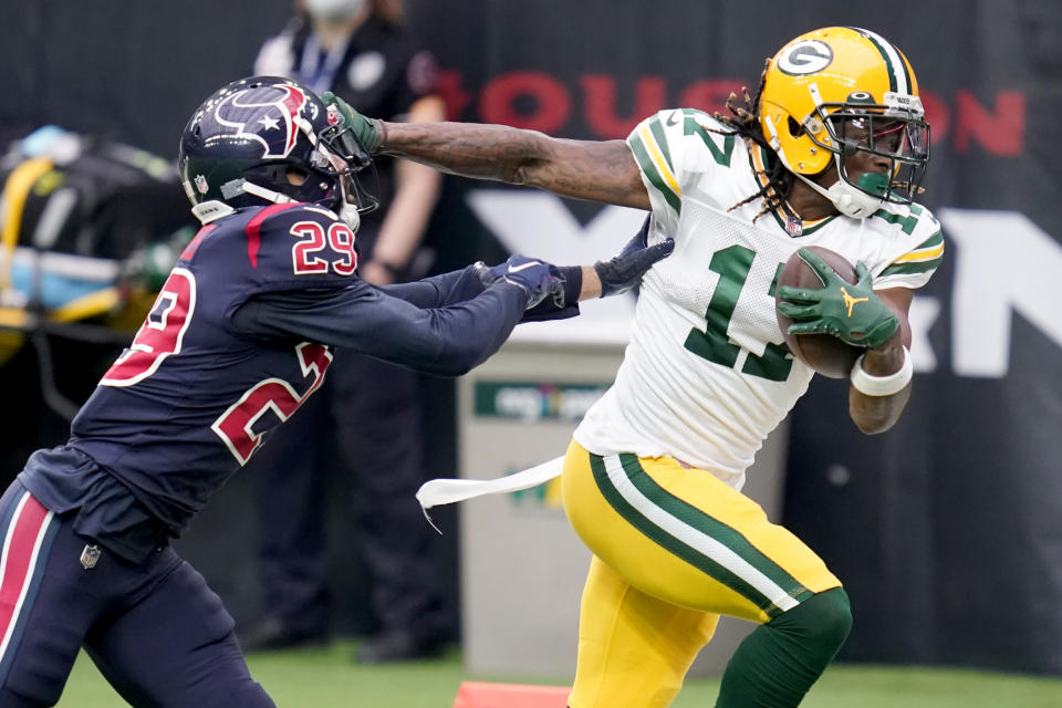 Green Bay Packers wide receiver Davante Adams (17) runs with the ball as Houston Texans cornerback Phillip Gaines (29) defends during the first half of an NFL football game Sunday, Oct. 25, 2020, in Houston. (AP Photo/Sam Craft)