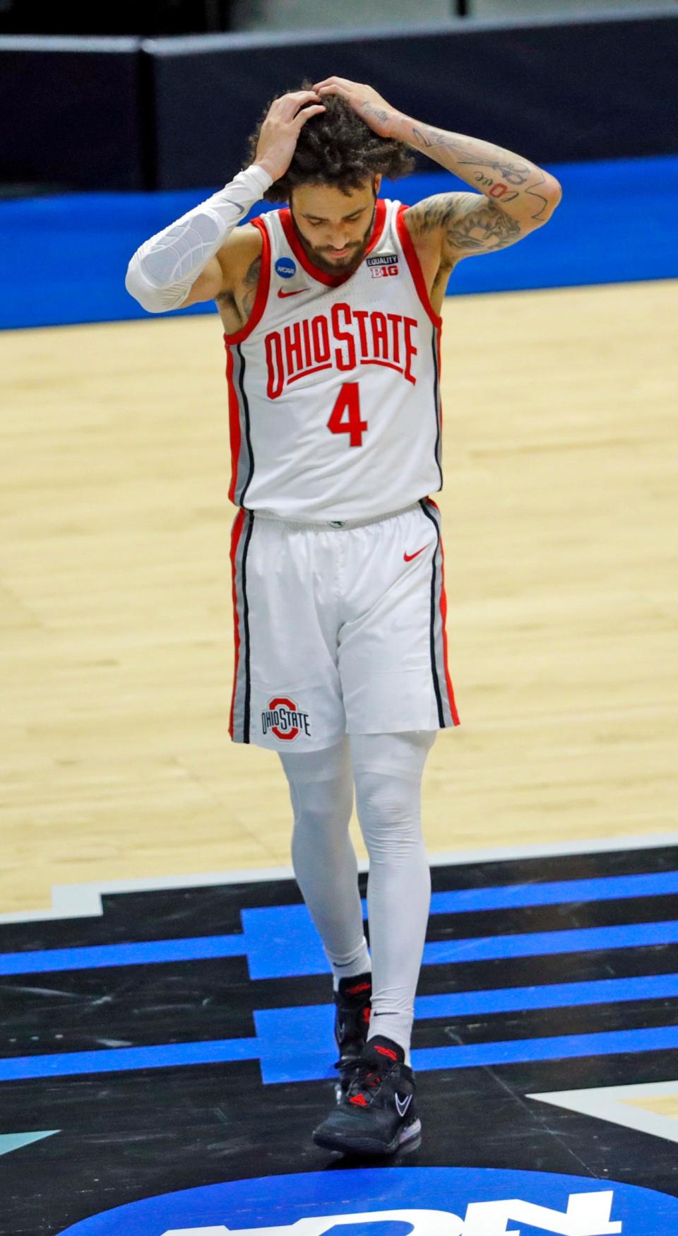 Ohio State Buckeyes guard Duane Washington Jr. (4) reacts to their loss to Oral Roberts Golden Eagles in overtime during the first round of the 2021 NCAA Tournament.