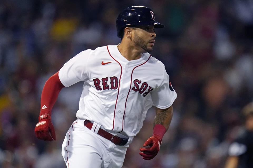 Boston Red Sox's Tommy Pham rounds the bases on his solo home run during the third inning of a baseball game against the Atlanta Braves, Tuesday, Aug. 9, 2022, in Boston. (AP Photo/Charles Krupa)