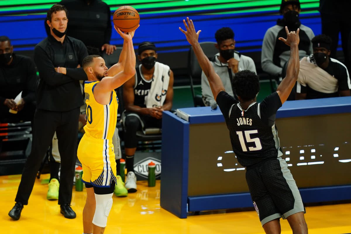 Stephen Curry of the Golden State Warriors shoots a three against the Sacramento Kings