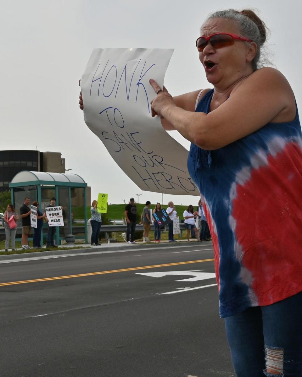 Beth Young of Cincinnati joined other demonstrators near St. Elizabeth Edgewood Hospital in Edgewood, Ky., on Aug. 10 to protest the hospital's COVID-19 vaccine requirement. Young says she is protesting for her daughter, who is a health care worker.