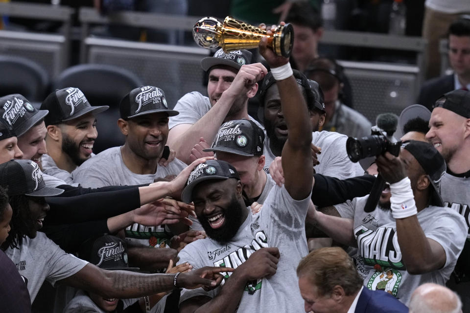 Boston Celtics guard Jaylen Brown, center, celebrates with his teammates after Game 4 of the NBA Eastern Conference basketball finals against the Indiana Pacers, Monday, May 27, 2024, in Indianapolis. The Celtics won 105-102. (AP Photo/Darron Cummings)