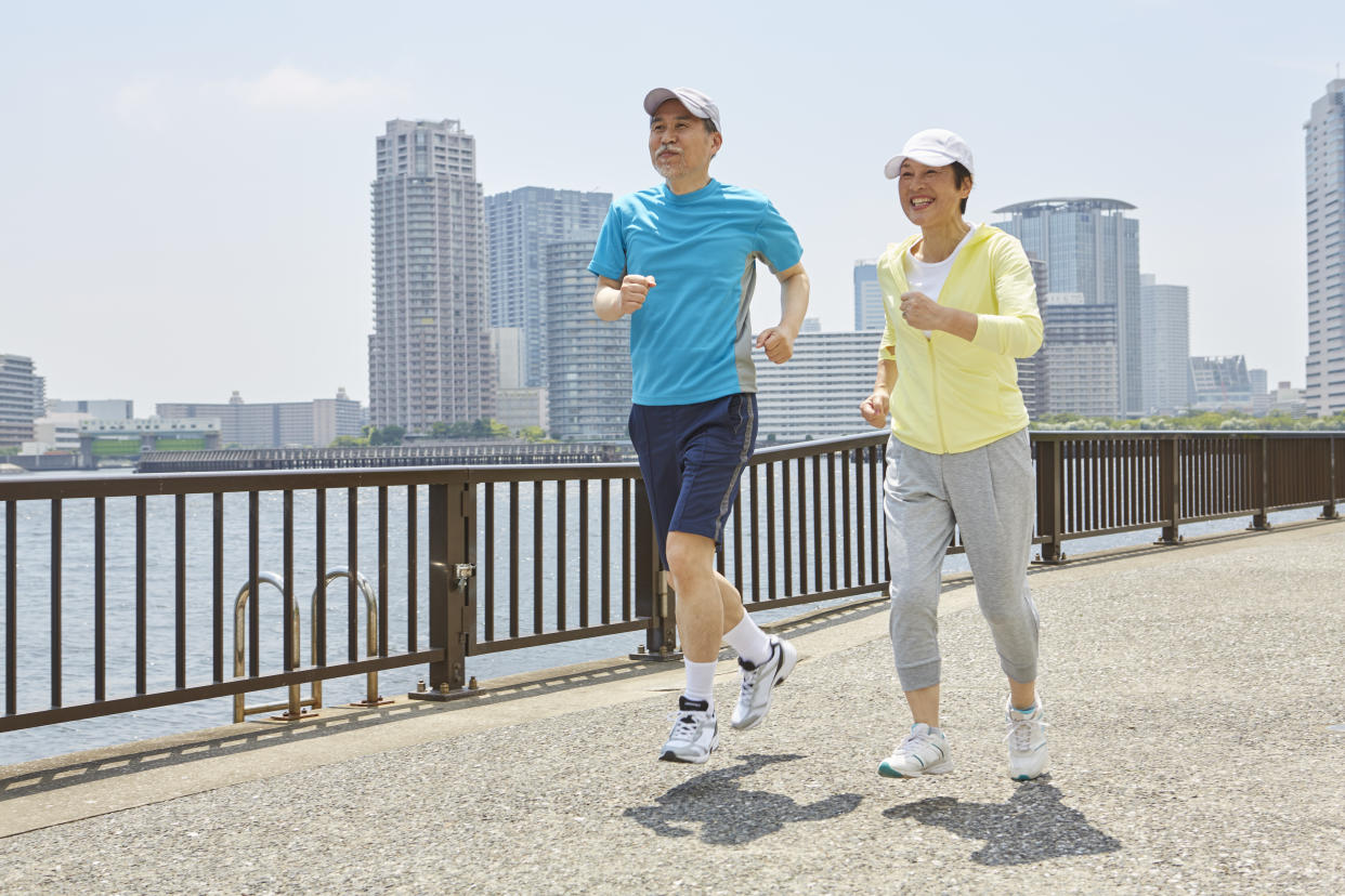 Japanese senior couple jogging.