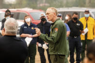 Sequoia and Kings Canyon National Parks Superintendent Clay Jordan speaks with firefighters battling the KNP Complex Fire during a morning briefing in Tulare County, Calif., on Thursday, Sept. 16, 2021. Jordan discussed the need to protect the parks' giant sequoia trees from high-intensity fire in the upcoming days. (AP Photo/Noah Berger)