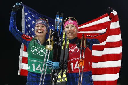 Cross-Country Skiing - Pyeongchang 2018 Winter Olympics - Women's Team Sprint Free Finals - Alpensia Cross-Country Skiing Centre - Pyeongchang, South Korea - February 21, 2018 - Jessica Diggins and Kikkan Randall of the U.S. celebrate. REUTERS/Dominic Ebenbichler