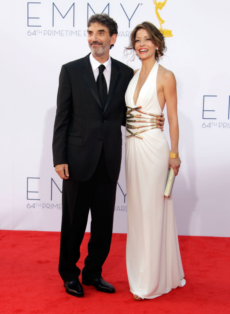 Chuck Lorre (L) and guest arrive at the 64th Primetime Emmy Awards at the Nokia Theatre in Los Angeles on September 23, 2012.