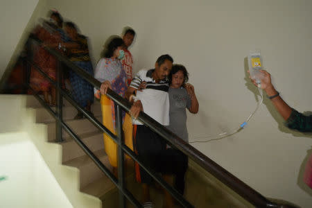 Patients are led down the stairs at Anutapura Hospital following an earthquake in Palu, Central Sulawesi, Indonesia, May 29, 2017 in this photo taken by Antara Foto. Antara Foto/Basri Marzuki/via REUTERS ATTENTION EDITORS - THIS IMAGE HAS BEEN SUPPLIED BY A THIRD PARTY. IT IS DISTRIBUTED, EXACTLY AS RECEIVED BY REUTERS, AS A SERVICE TO CLIENTS. FOR EDITORIAL USE ONLY. NOT FOR SALE FOR MARKETING OR ADVERTISING CAMPAIGNS. MANDATORY CREDIT. INDONESIA OUT. NO COMMERCIAL OR EDITORIAL SALES IN INDONESIA.