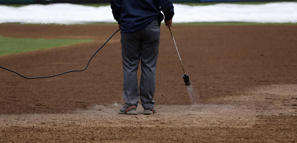 A grounds crew member heats the infield of Citizens Bank Park before a baseball game between the Philadelphia Phillies and Washington Nationals, Monday, Sept. 10, 2018, in Philadelphia. (AP Photo/Matt Slocum)