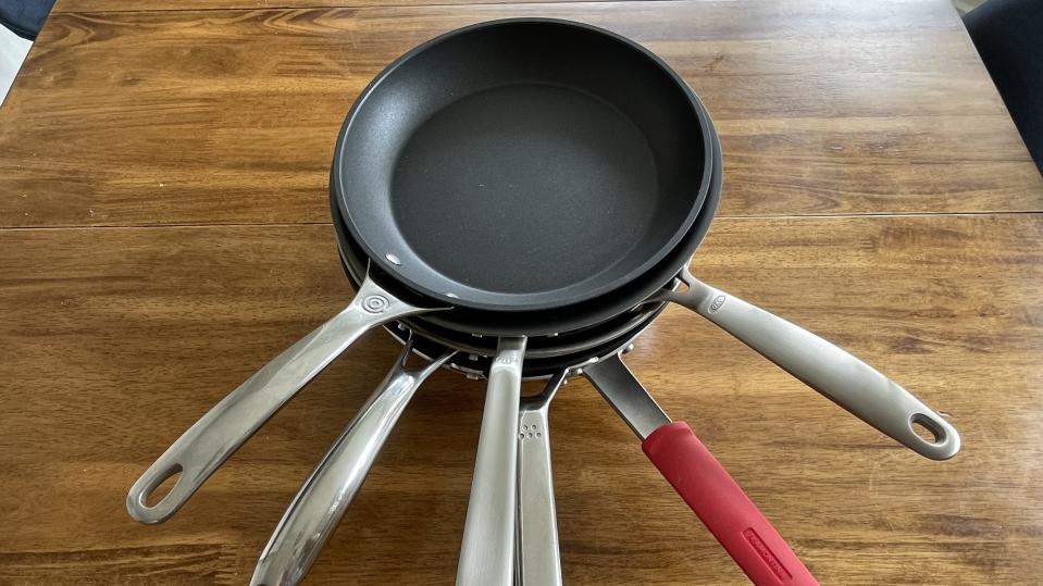 Overhead image of a stack of 6 nonstick pans
