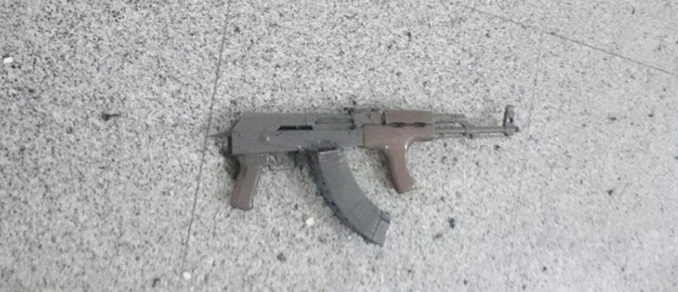 An AK-47 was found lying abandoned on the floor. Photo: Reuters